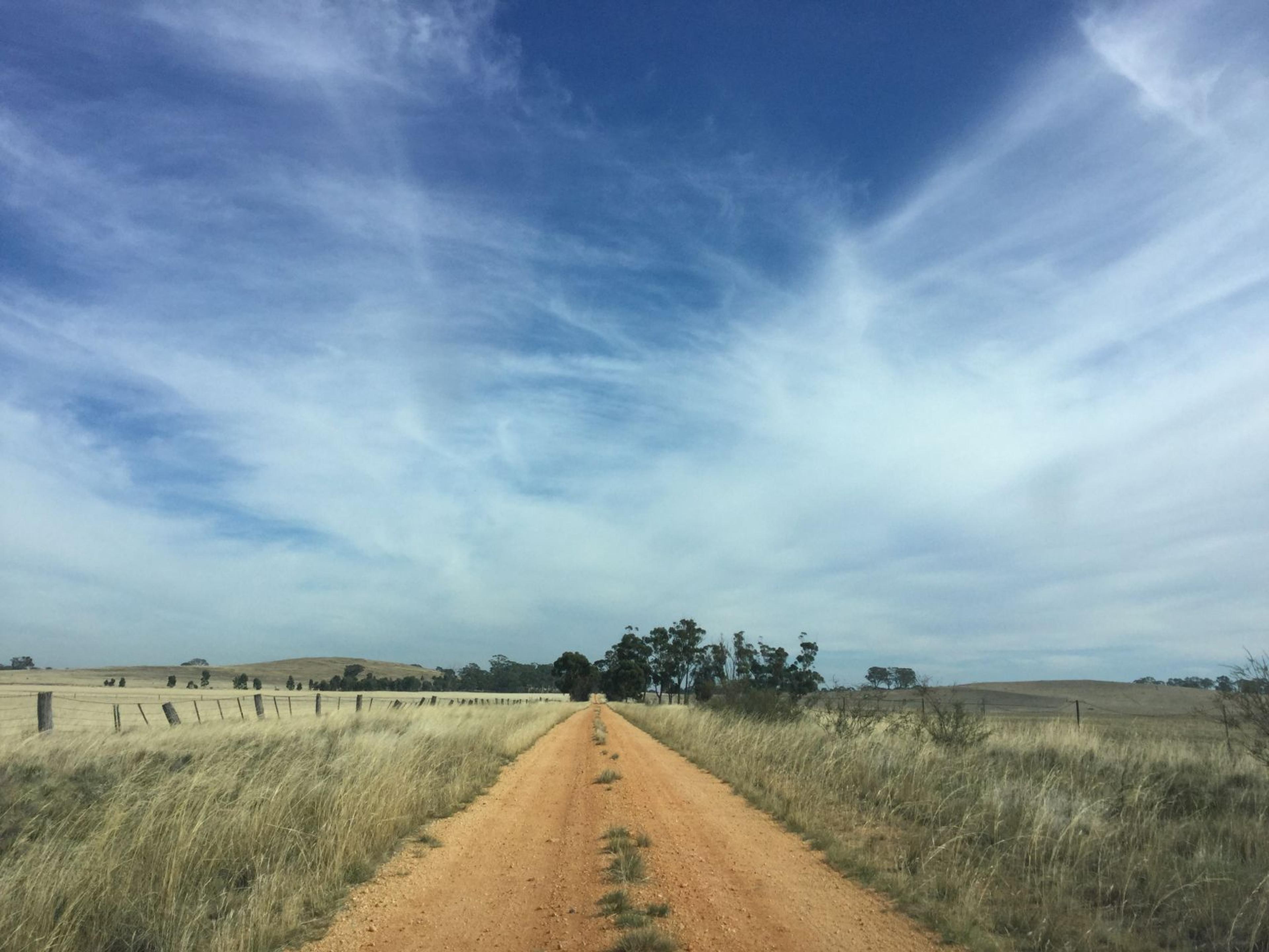 Ford Bronco Basecamp adventure hybrid SUV touring an Australian outback dirt road