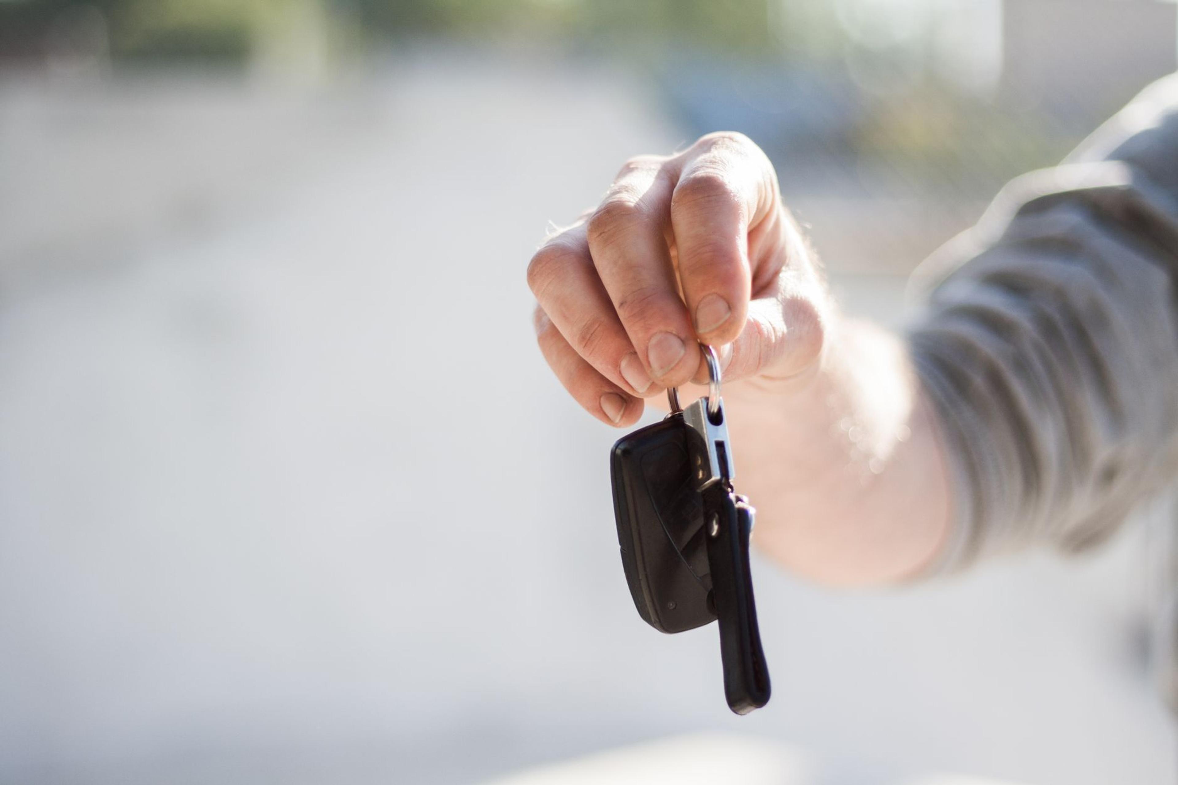 Car keys being handed over, representing a new 4x4 purchase