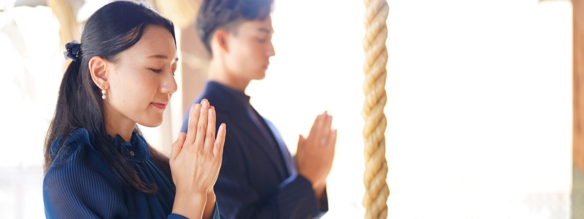Man and woman praying.