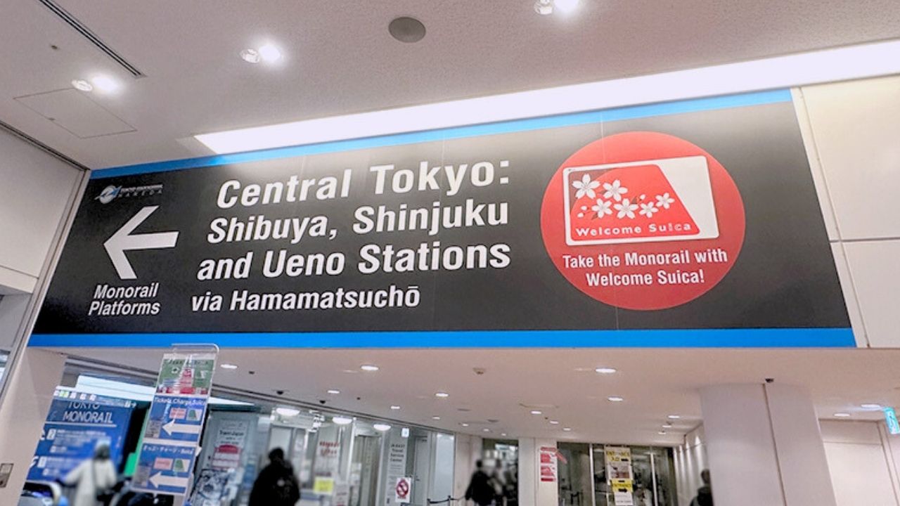 A large station sign directs to Monorail Platforms for Central Tokyo, Shibuya, Shinjuku, and Ueno Stations