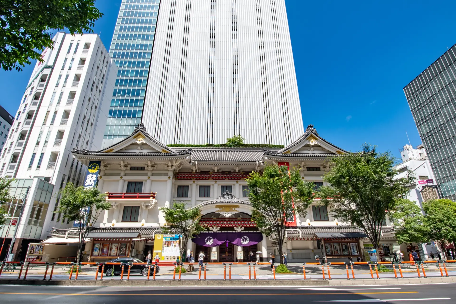 a large building with a roof that looks like a castle is in the middle of a city .