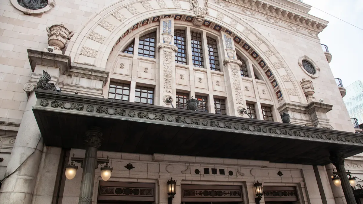 a large building with a large arch over the entrance .