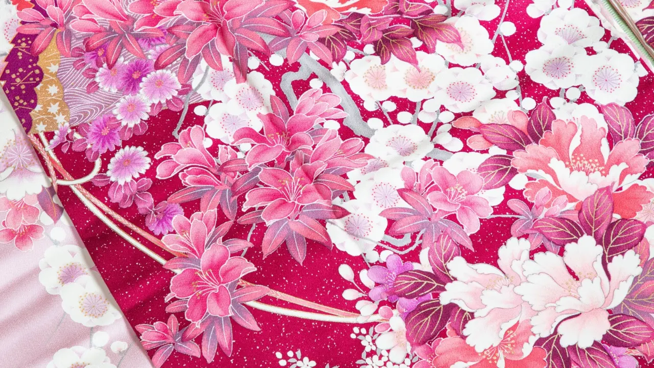 Intricate Japanese floral pattern on magenta fabric, with pink peonies and white blossoms.