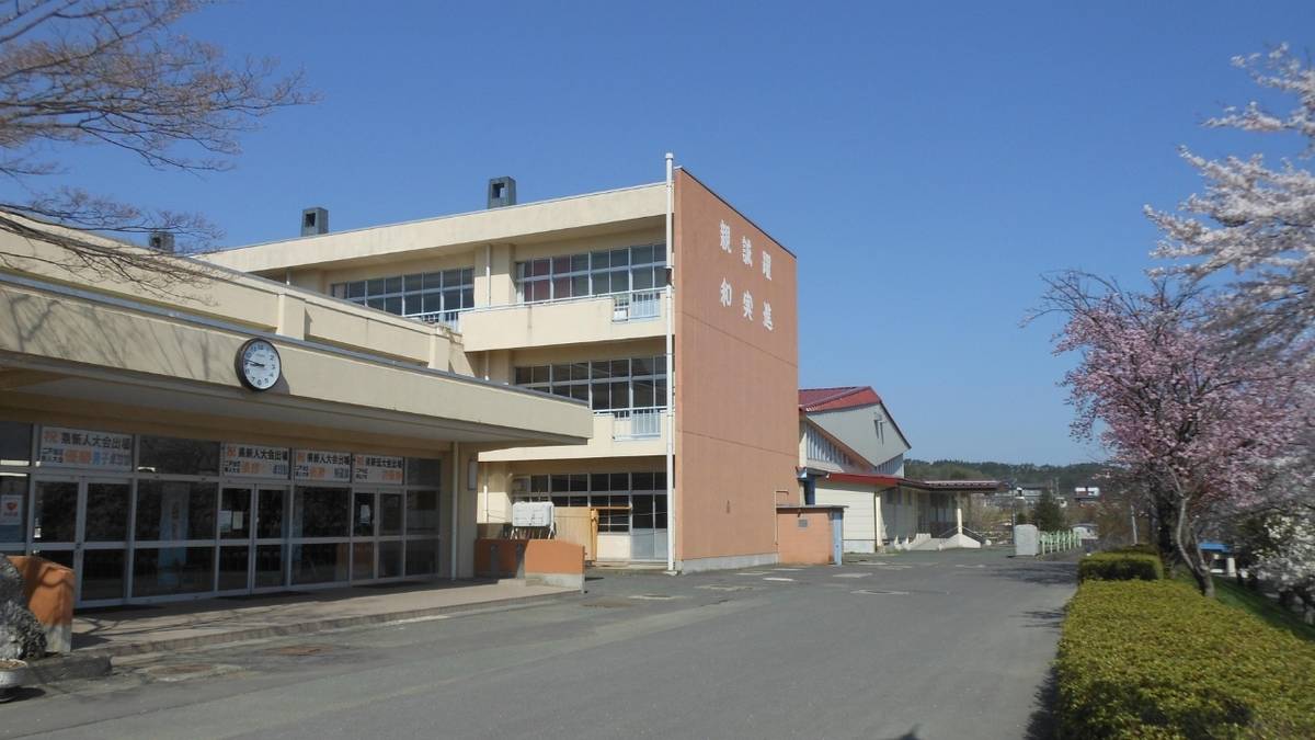 a large building with a lot of windows and a clock on the side of it .