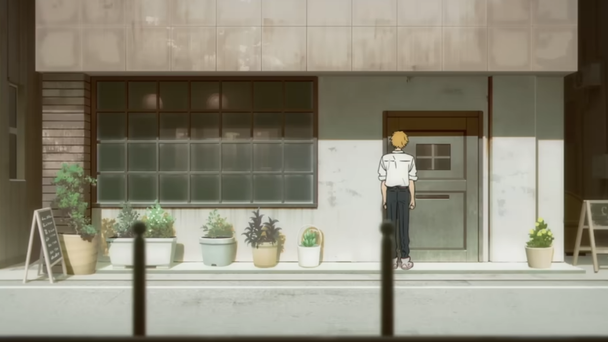 Denji stands facing a shop decorated with potted plants.