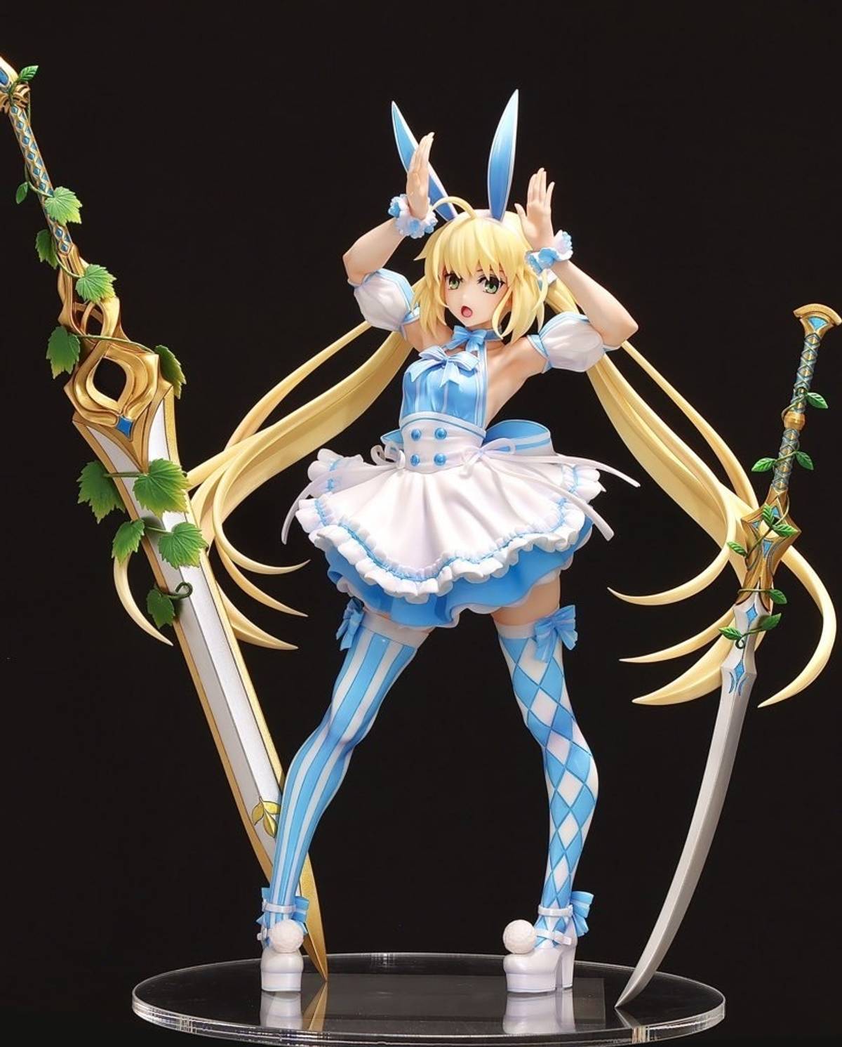 Anime figure of a blonde bunny girl in a blue and white ruffled dress with mismatched patterned thigh-high socks