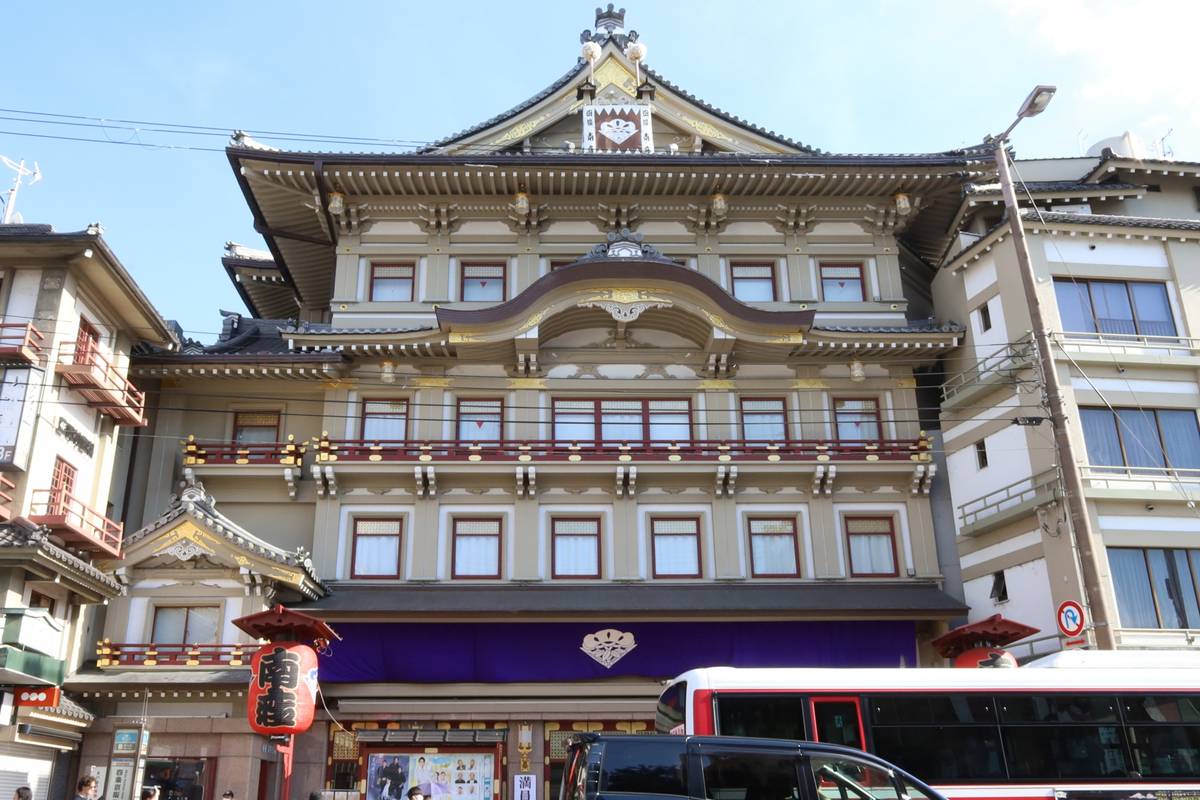 a large building with a lot of windows and a bus parked in front of it .