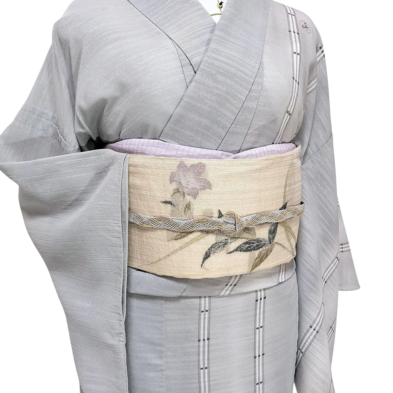 Light gray kimono with a cream obi featuring a purple flower and green leaves, secured by a braided cord.