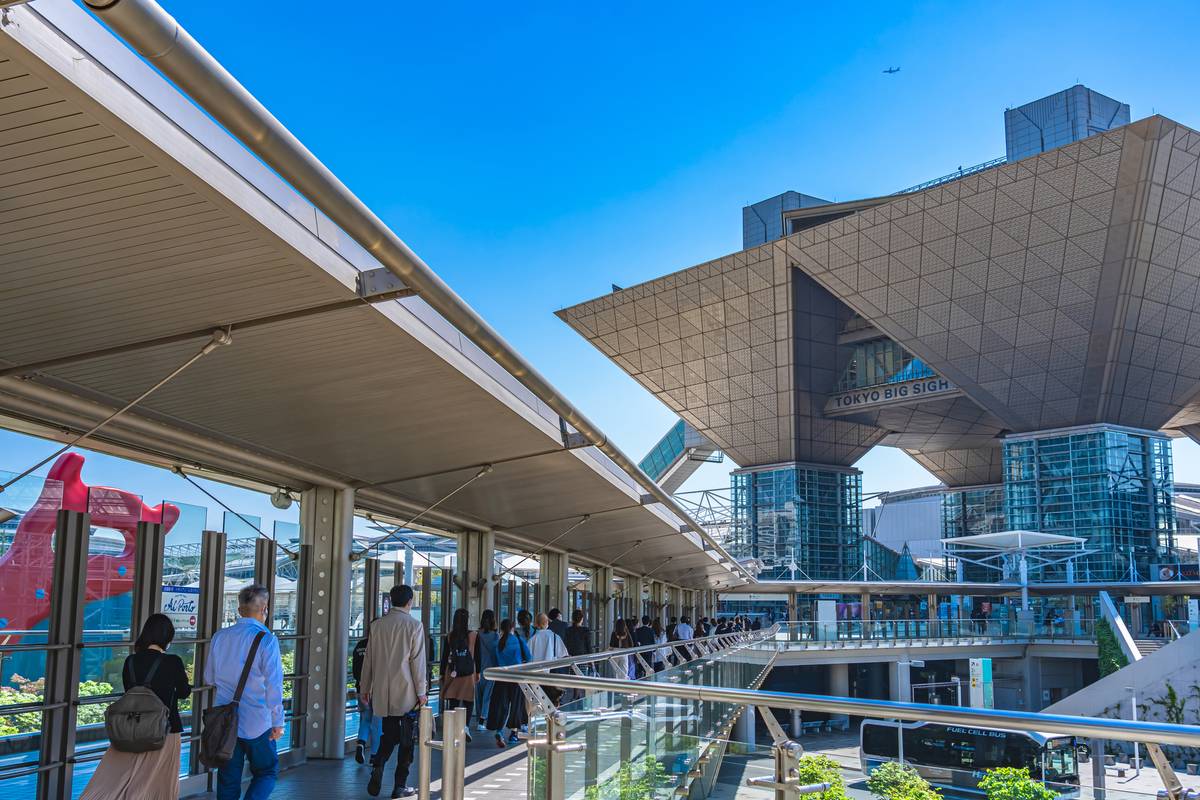 Tokyo Big Sight convention center with a busy pedestrian walkway.
