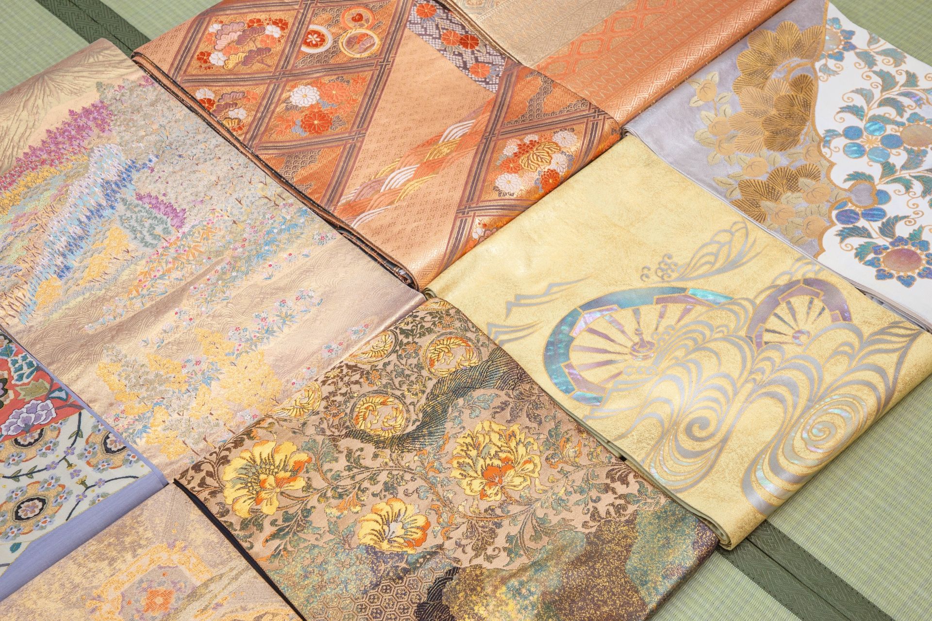 Close-up of intricately patterned Japanese textiles, folded and arranged diagonally.