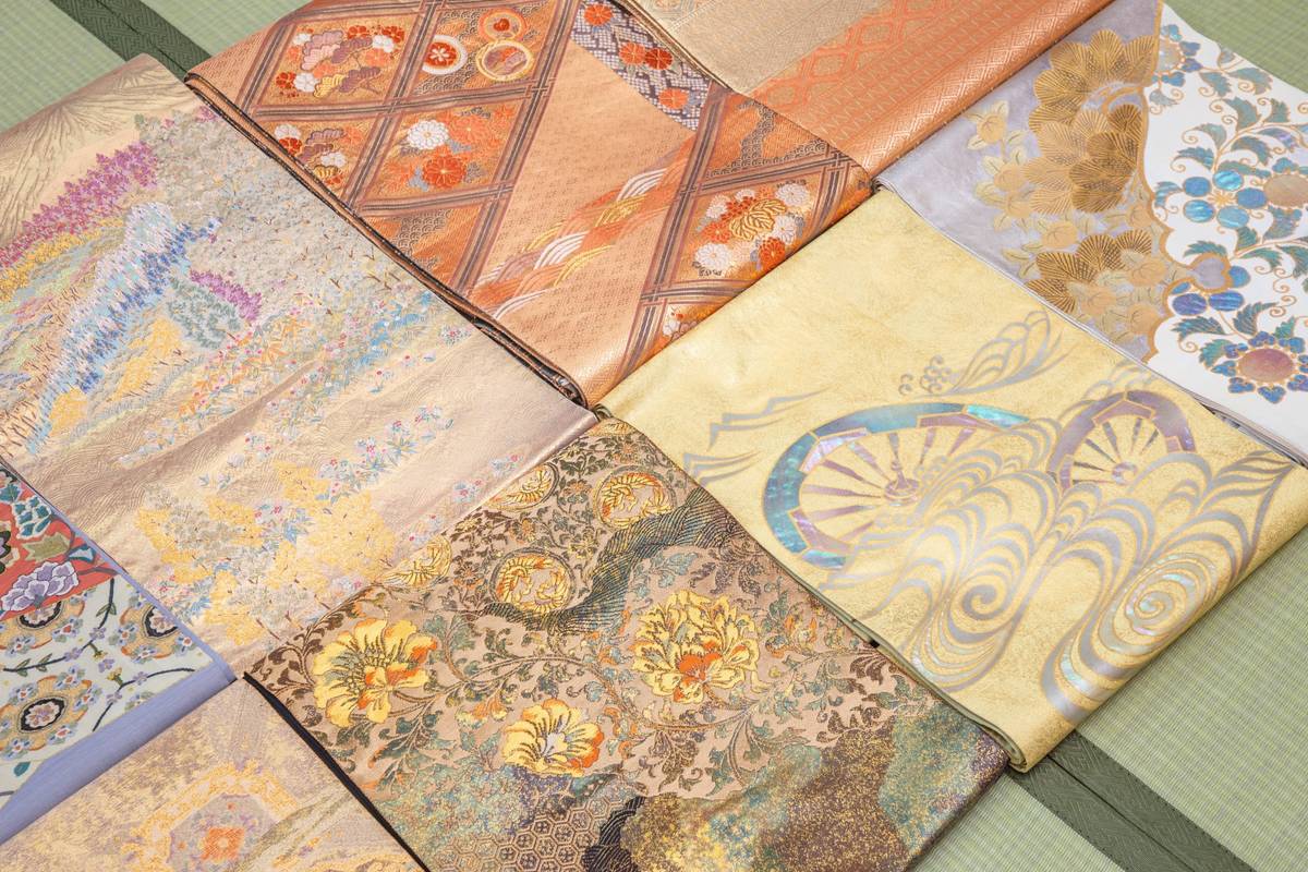Close-up of intricately patterned Japanese textiles, folded and arranged diagonally.