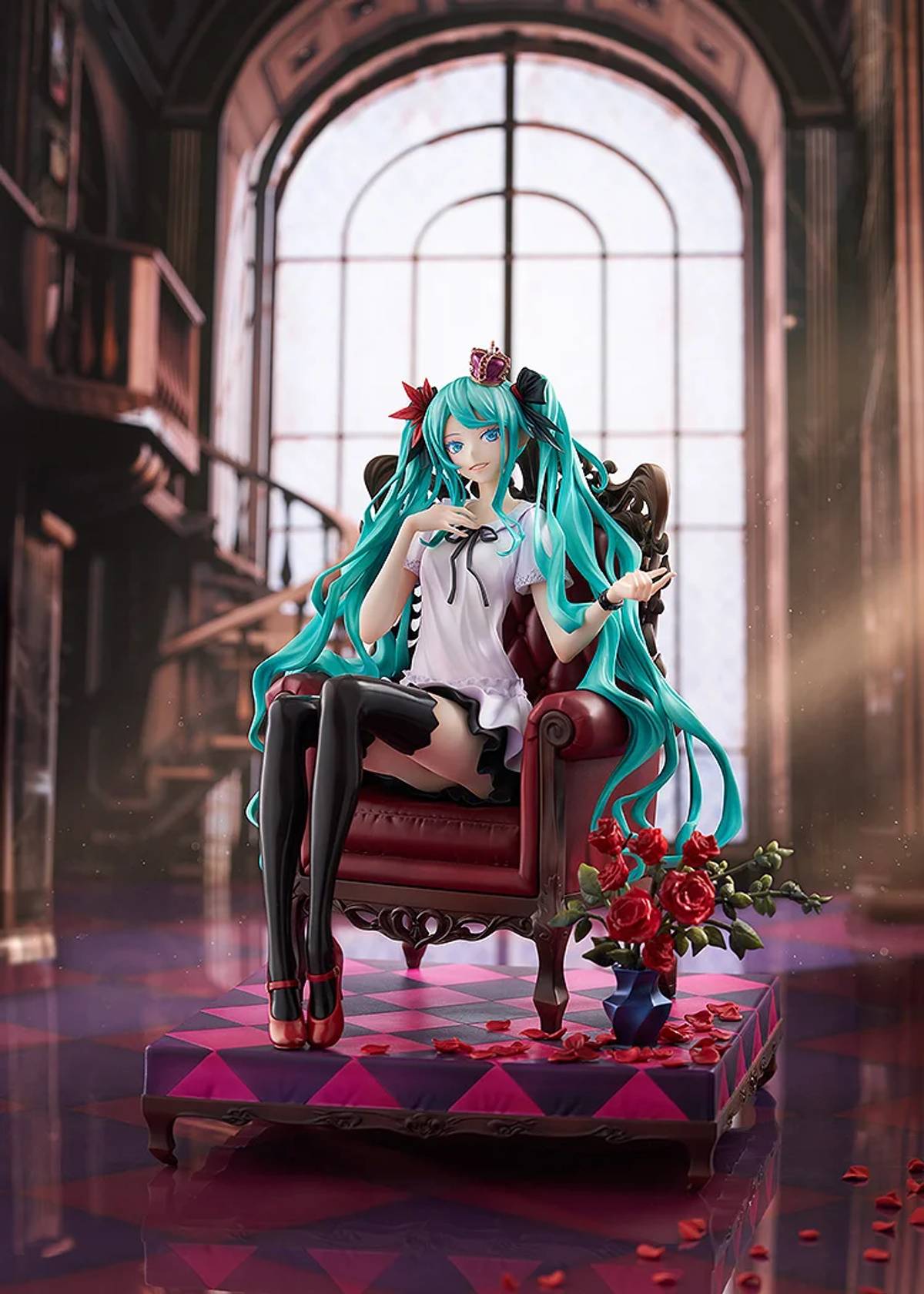 Hatsune Miku figure with teal pigtails and a crown sits on an ornate red armchair in a grand room, surrounded by red roses.