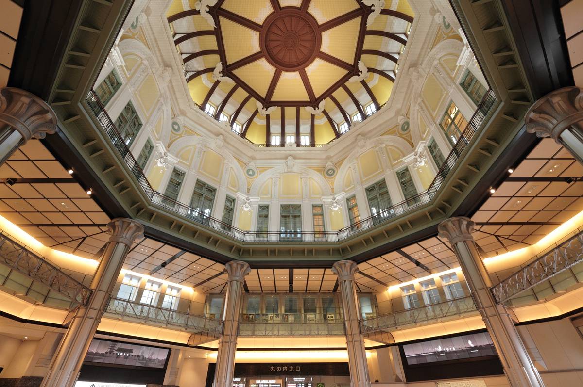 Ornate octagonal dome of Tokyo Station's Marunouchi Building, with yellow and white architectural details.
