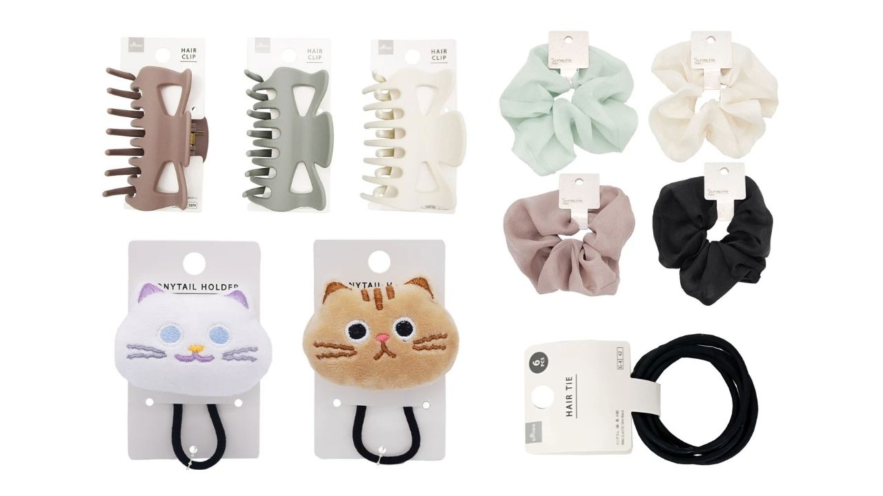 An assortment of hair accessories including three neutral-toned claw clips, four pastel and black scrunchies