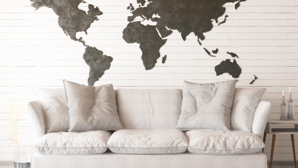 A sofa with a world map in the background
