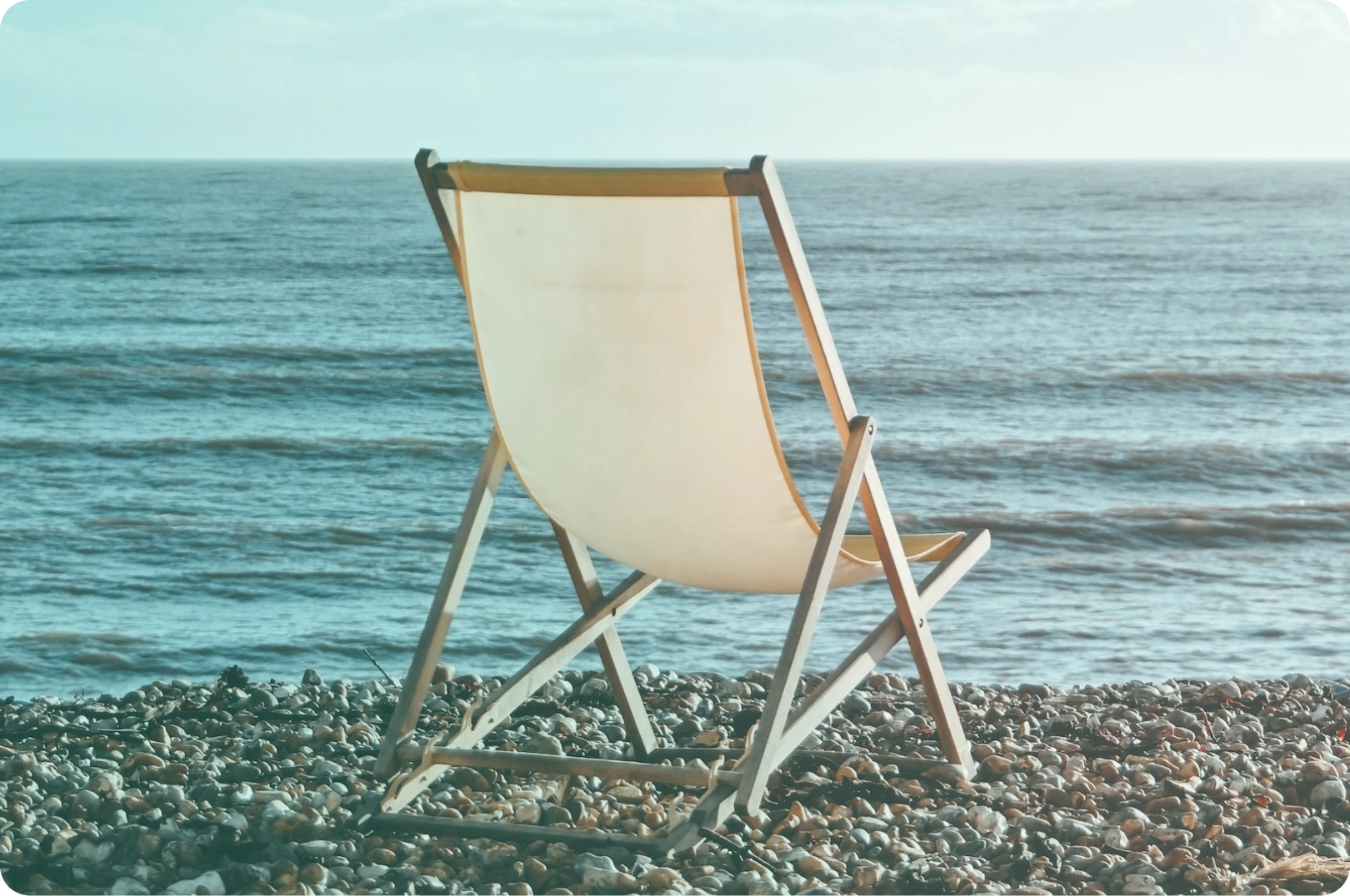image of a deck chair on a beach