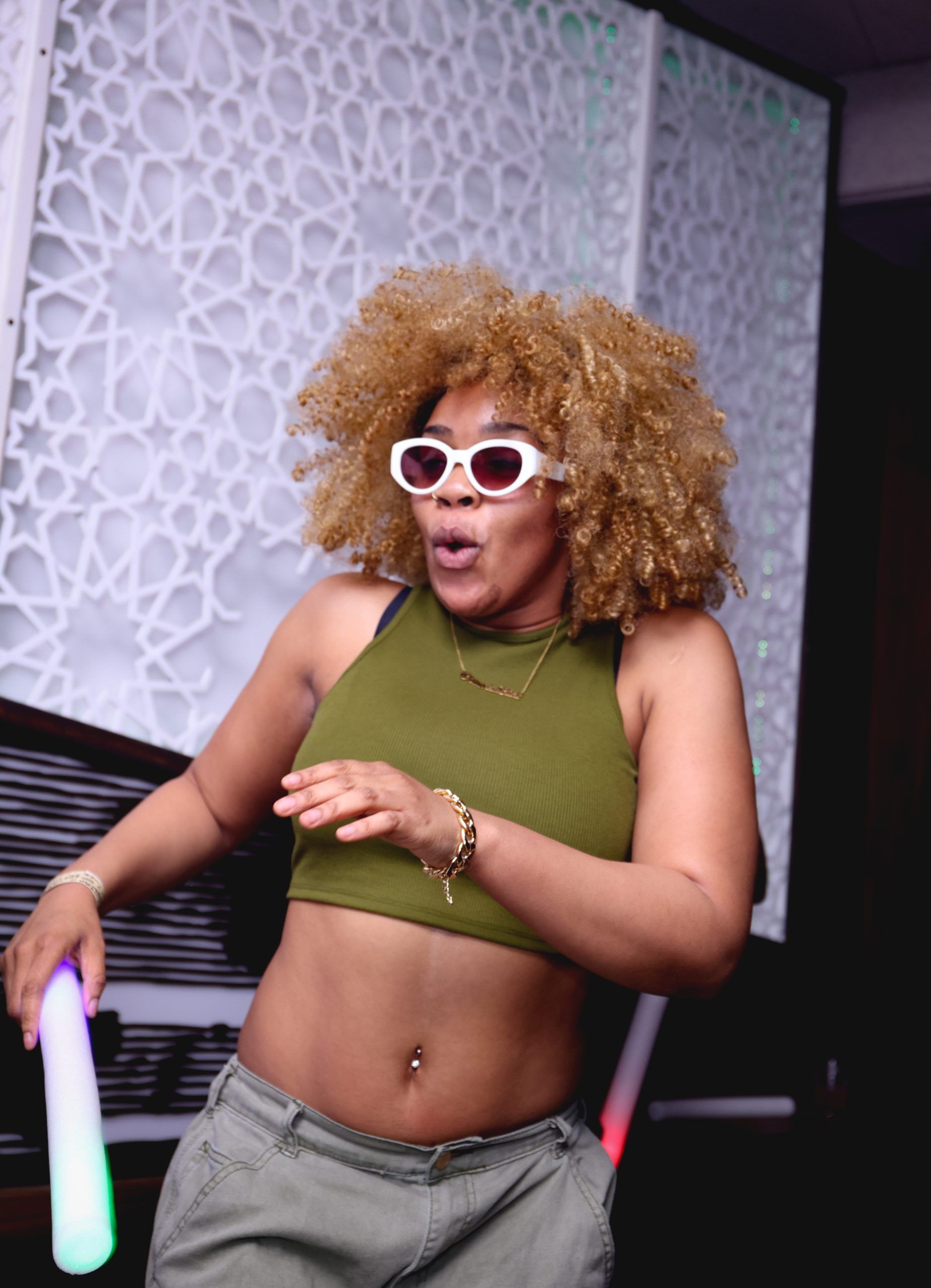 A guest in sunglasses posing at Afrobeat Nights