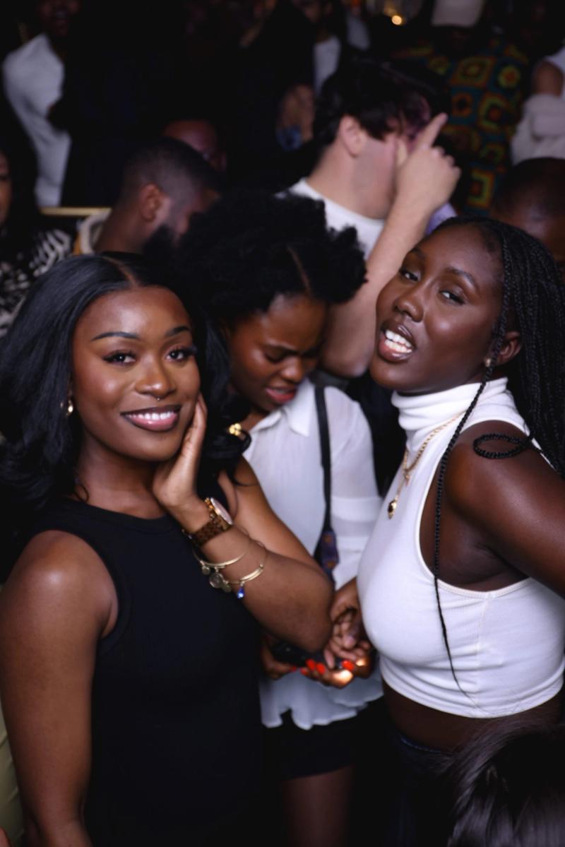 Two guests posing on the dance floor
