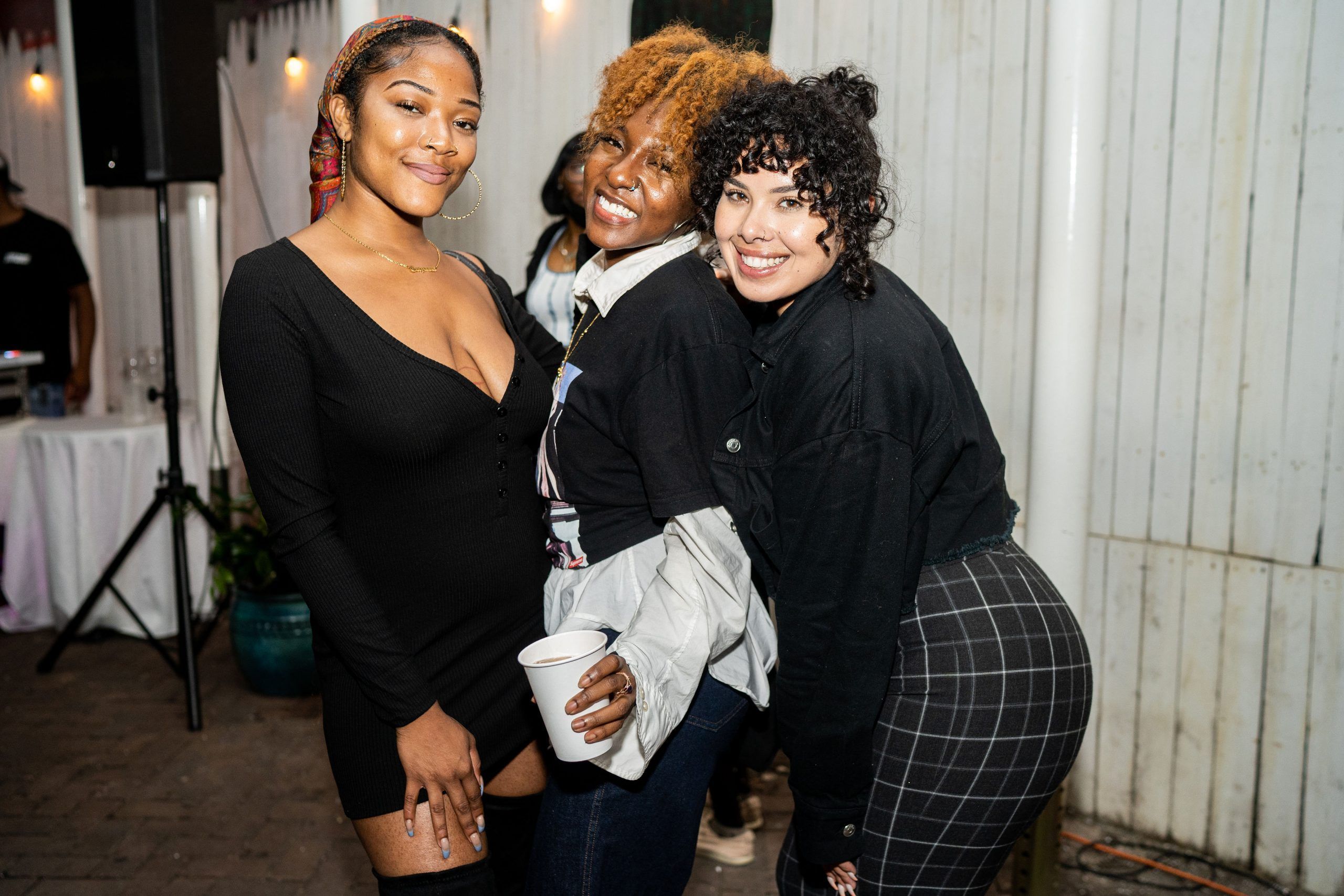 Three guests smiling for the camera
