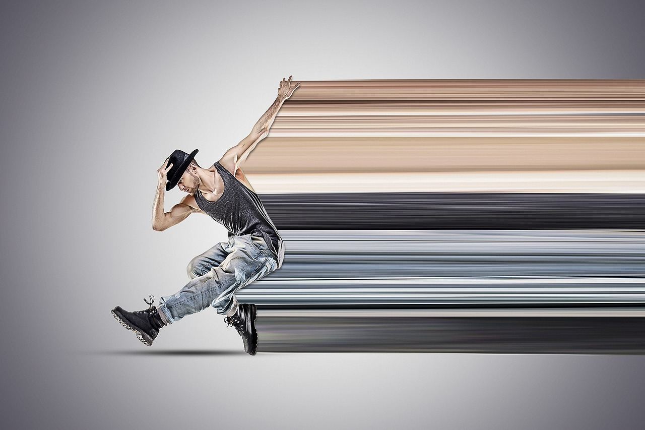 A dynamic street dancer showcases impressive moves against an urban backdrop, embodying the energy and rhythm of hip-hop culture.