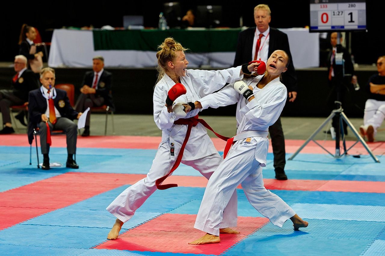 A skilled martial artist executes a high kick in a dynamic karate stance, showcasing strength and precision.