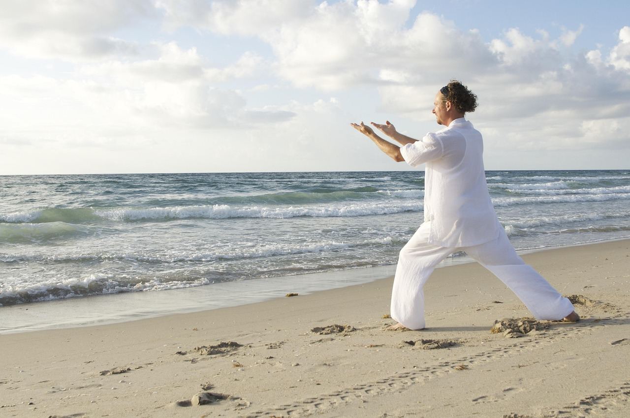 Individual practicing breath control on the beach, embodying tranquility for 'Is Pranayama for you? Let's find out!'