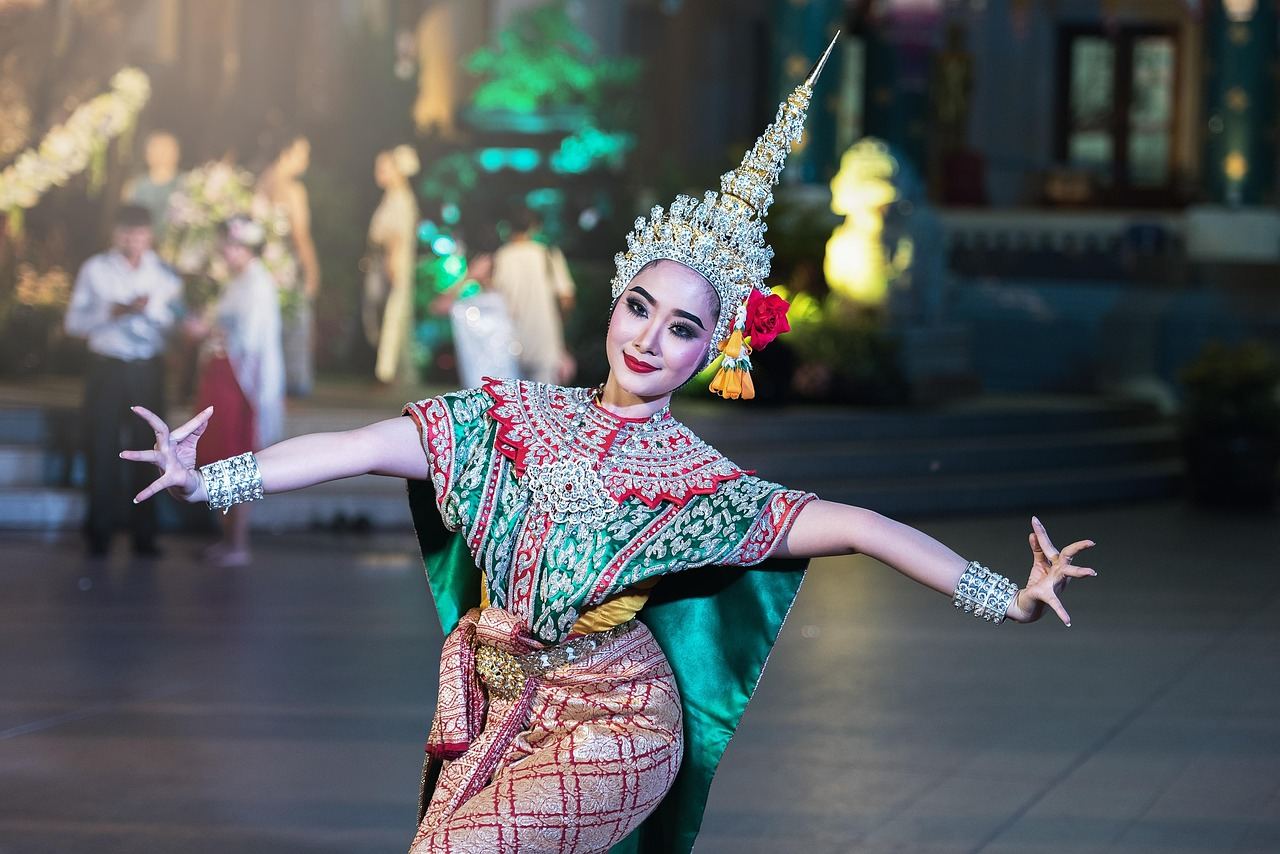 A vibrant scene from the Ramayana festival, showcasing performers in colorful traditional costumes enacting dramatic scenes.