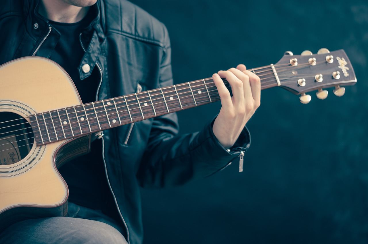 A person playing classical guitar, exploring techniques for 'Is Classical Guitar for you? Let's find out!'