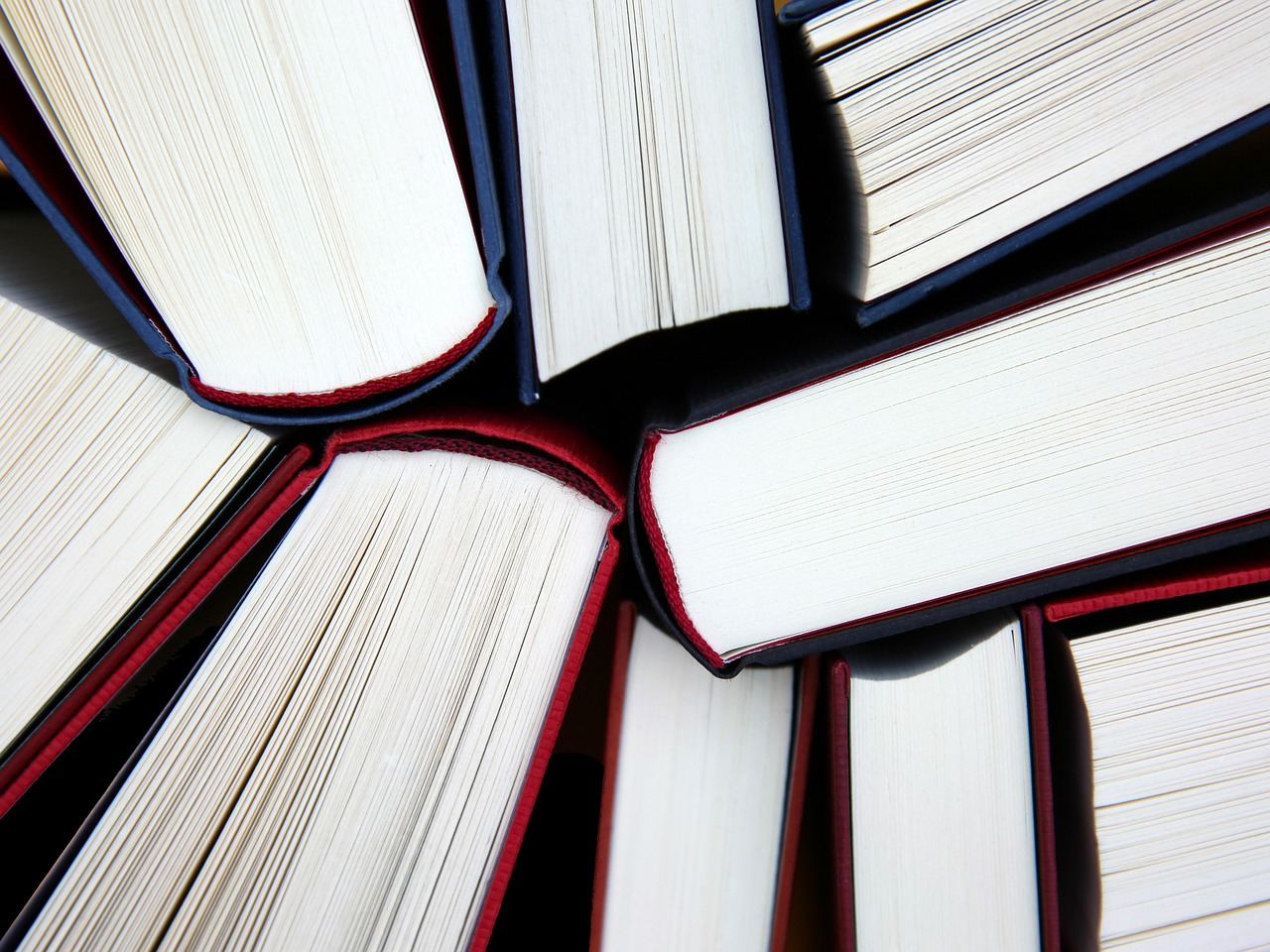An arrangement of open books symbolizing research reading for 'Is Research Reading for you? Let's find out!'