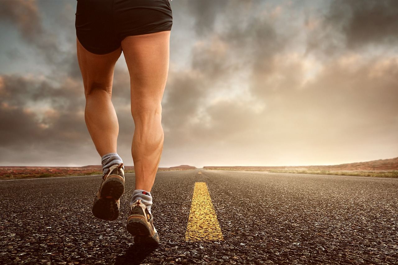 A determined runner strides along a scenic path, showcasing the energy and focus of duathlon training.