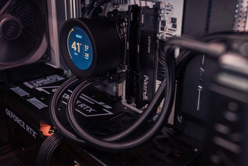 A close-up of a gaming PC's internal components, showcasing a liquid cooler and graphics card.