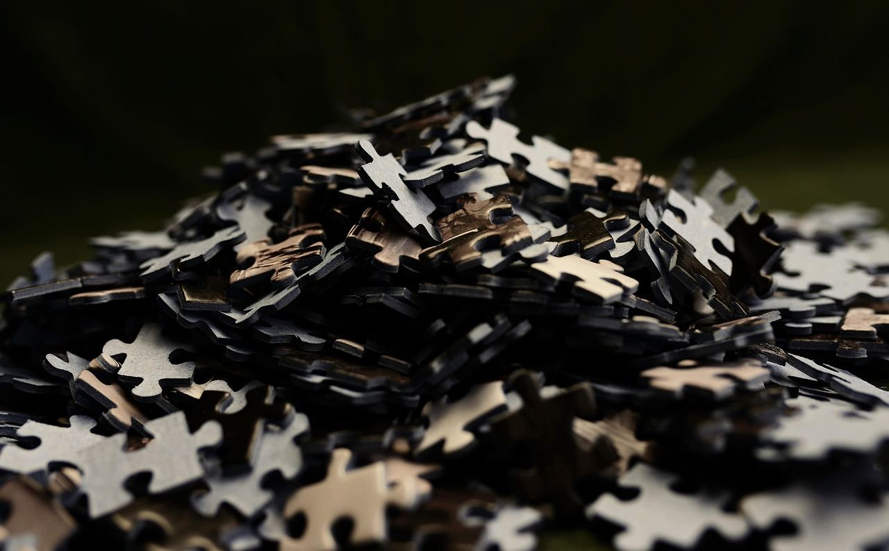 A pile of puzzle pieces representing challenges in brain training. Is Brain Training for you? Let's find out!