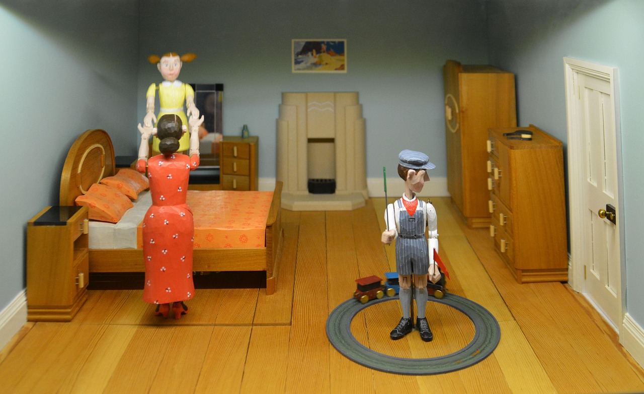 A beautifully crafted dollhouse with intricate details, showcasing tiny furniture and decor in each room.