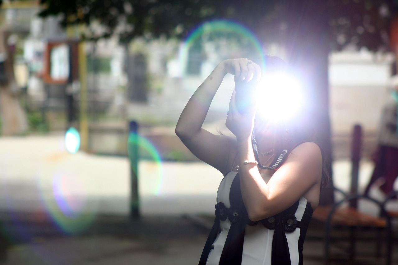 A photographer capturing a moment with a flash, embodying the spirit of documentary photography.