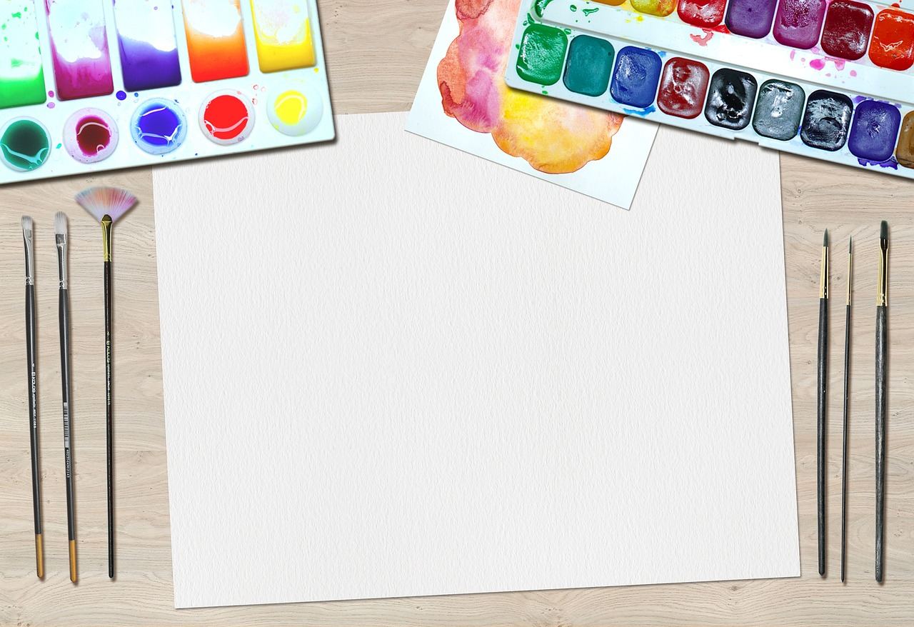 Art supplies for marbling: brushes, paints, and a blank canvas for 'Is Paper Marbling for you? Let's find out!'