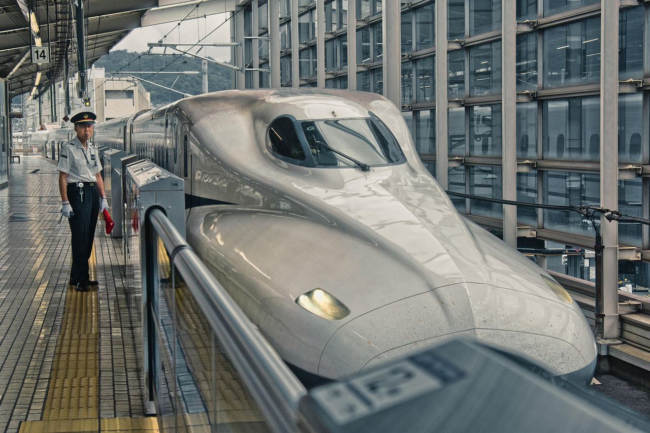 A Shinkansen bullet train at a station, perfect for exploring if trainspotting is for you.
