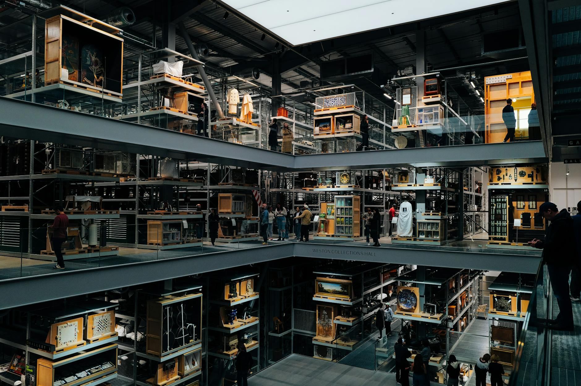 An intriguing view of a modern art museum interior with multiple floors and visitors observing exhibits.
