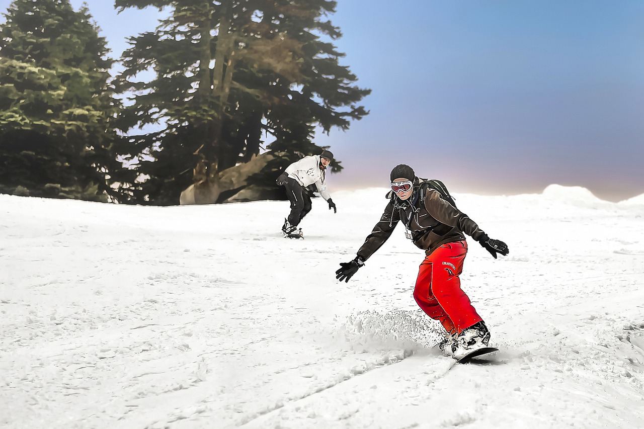 A snowboarder gracefully carves through fresh powder on a sunlit mountain slope, showcasing dynamic movement and skill.