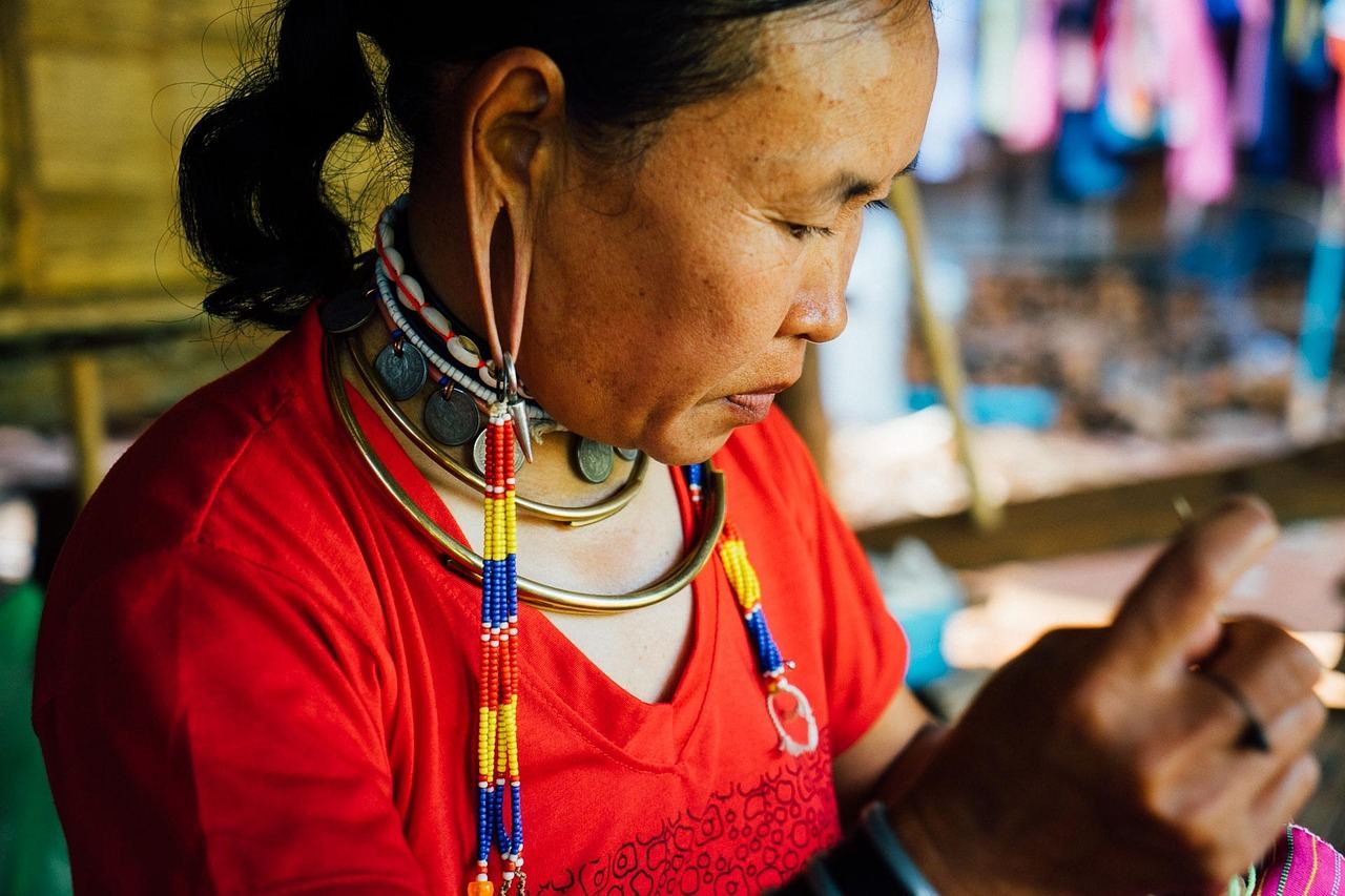 A woman creating intricate beadwork, embodying the essence of 'Is Beadwork for you? Let's find out!'