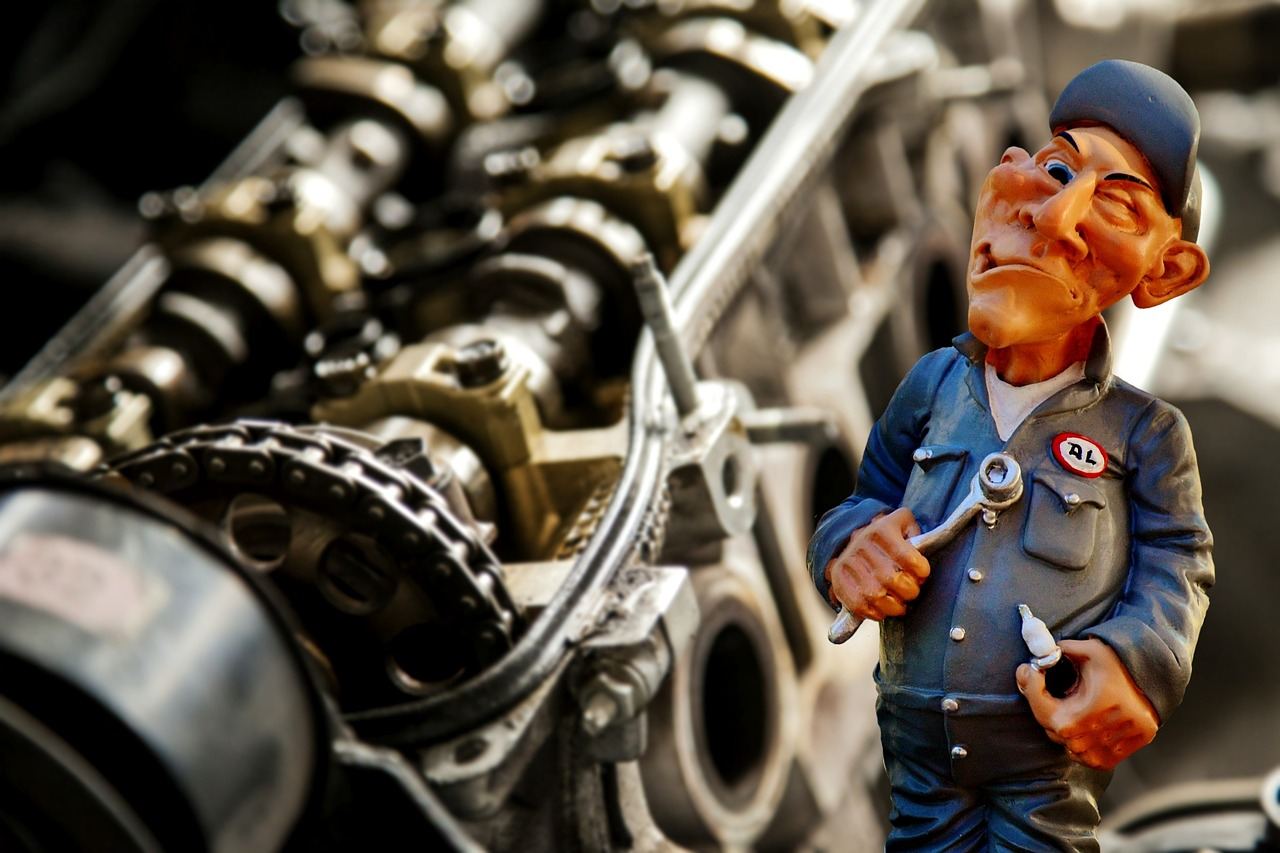 A cartoon mechanic figure stands next to an engine, representing the theme of 'Is Auto Repair for you? Let's find out!'