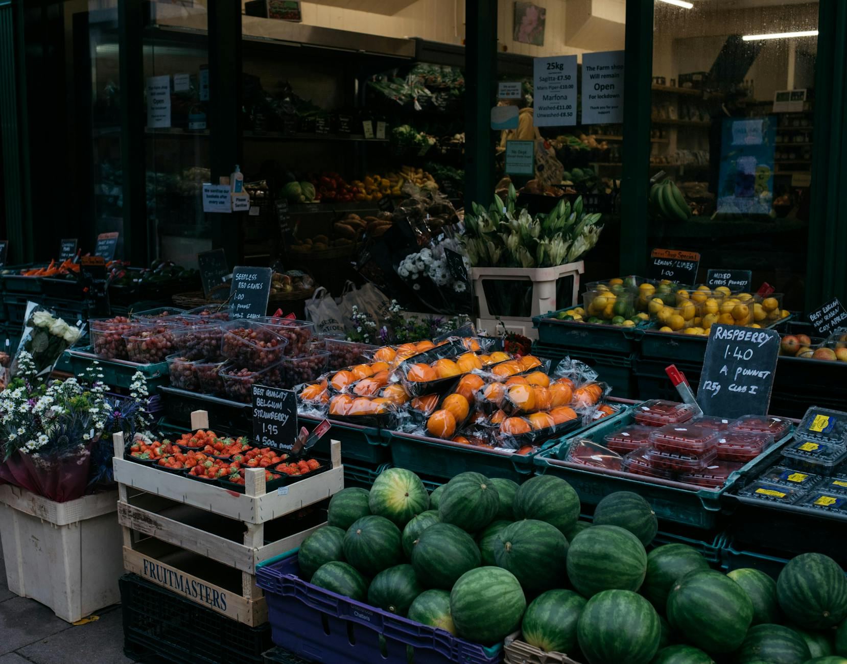 Vibrant local market stall featuring a variety of fresh fruits and vegetables, enticing shoppers.