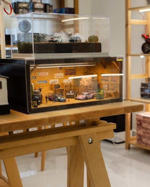 A detailed diorama showcasing miniature cars and a garage setting, perfect for diorama building enthusiasts.