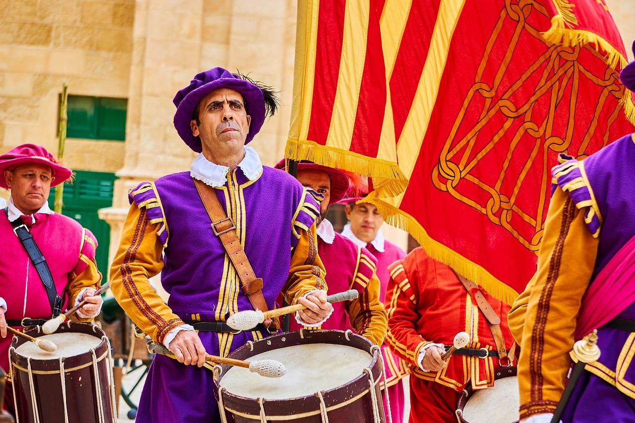 Colorful drummers in traditional attire performing, inviting you to explore percussion. Is Percussion for you? Let's fin