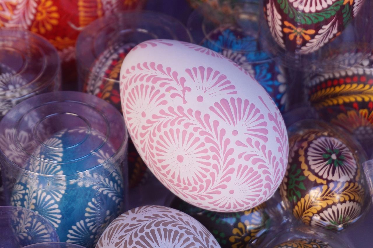 Colorful decorated eggs with intricate patterns and vibrant hues, symbolizing the art of Pysanky during Easter celebrations.