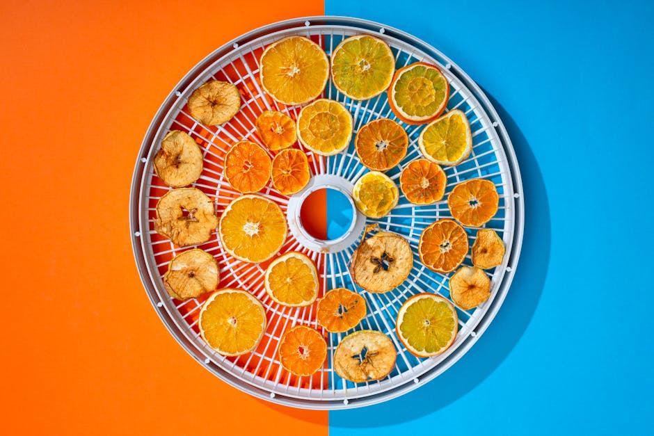 A circular tray filled with various dried citrus fruits on a colorful background.