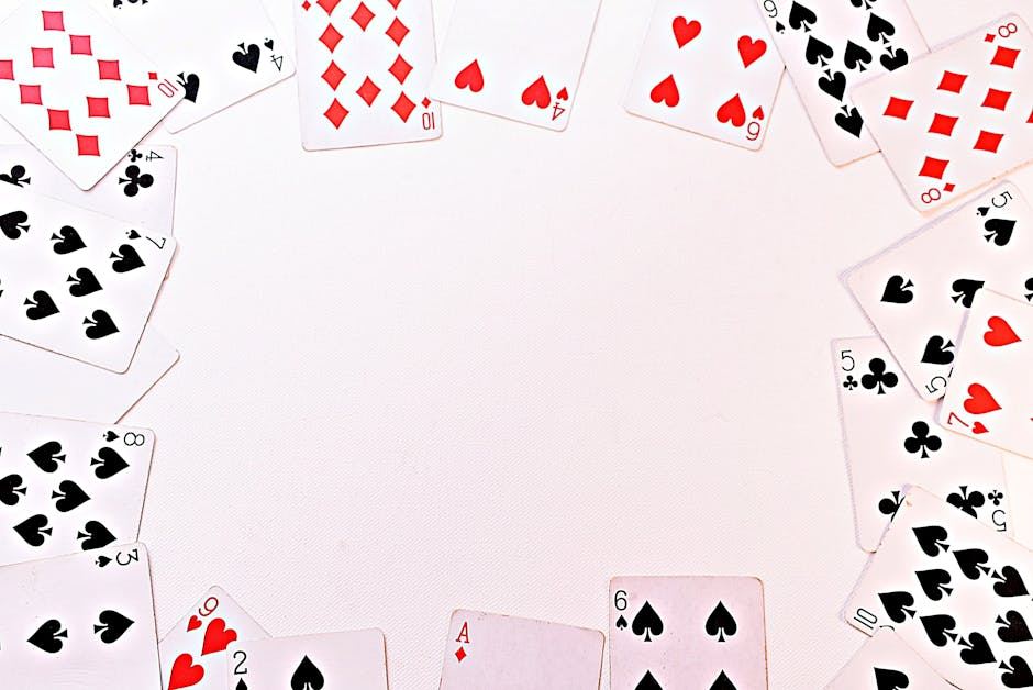 A circular arrangement of playing cards is displayed on a white background. The cards feature various suits, including hearts, diamonds, and spades. Notable cards include an Ace of spades, a 10 of diamonds, and a 9 of hearts. The center is empty, emphasizing the surrounding cards.