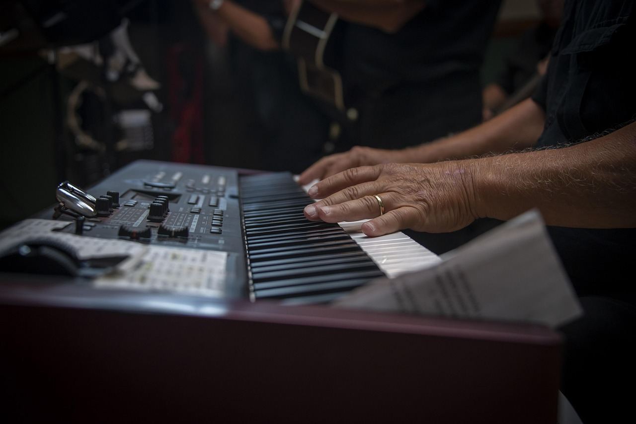 Close-up of hands playing a keyboard, exploring jazz piano in 'Is Jazz Piano for you? Let's find out!'