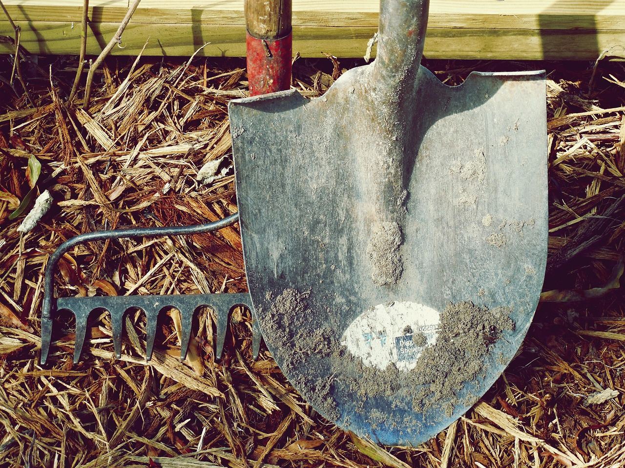 A detailed etching of a shovel, showcasing intricate designs and textures on its metallic surface.