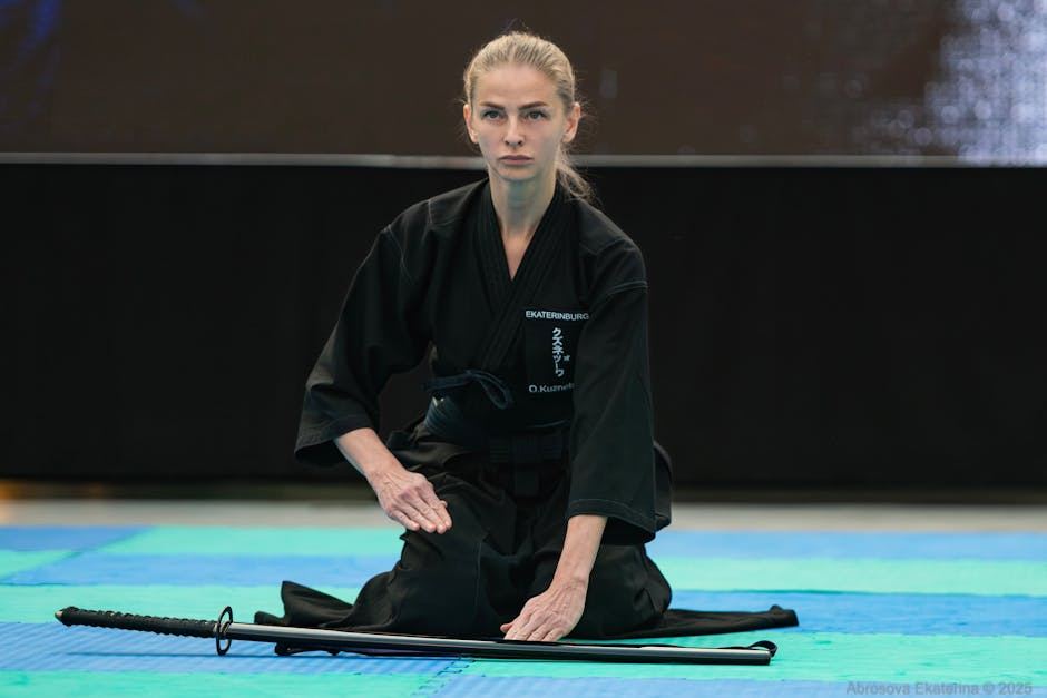 A practitioner in traditional attire performs Iaido, focusing on mindfulness and discipline with a katana.