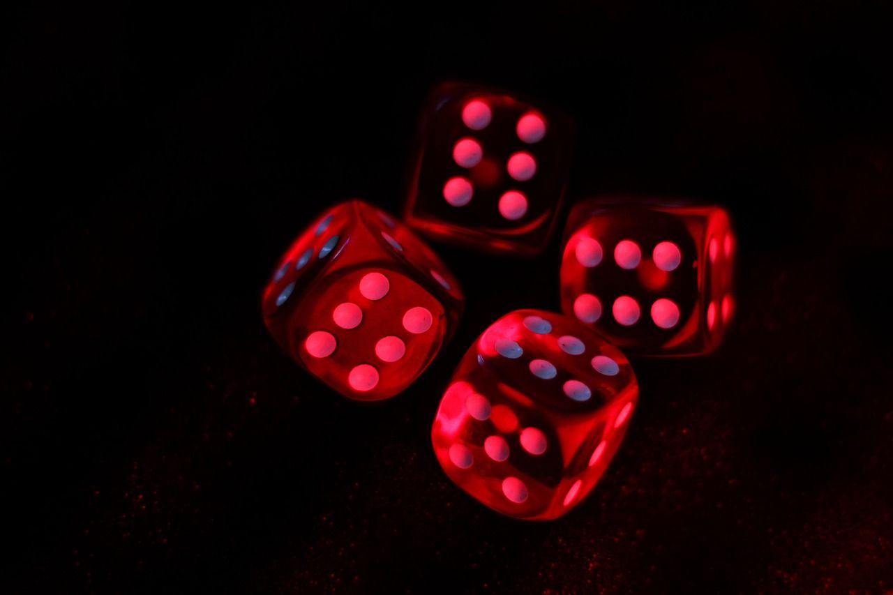 Red glowing dice symbolize chance and strategy in 'Is Fantasy RPGs for you? Let's find out!'